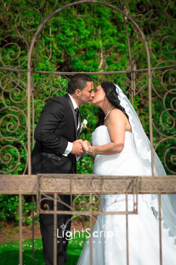 Groom and bride kissing