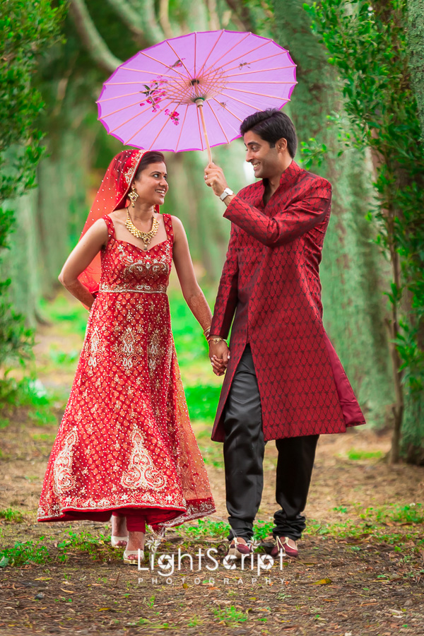 new couple walking with ambrella