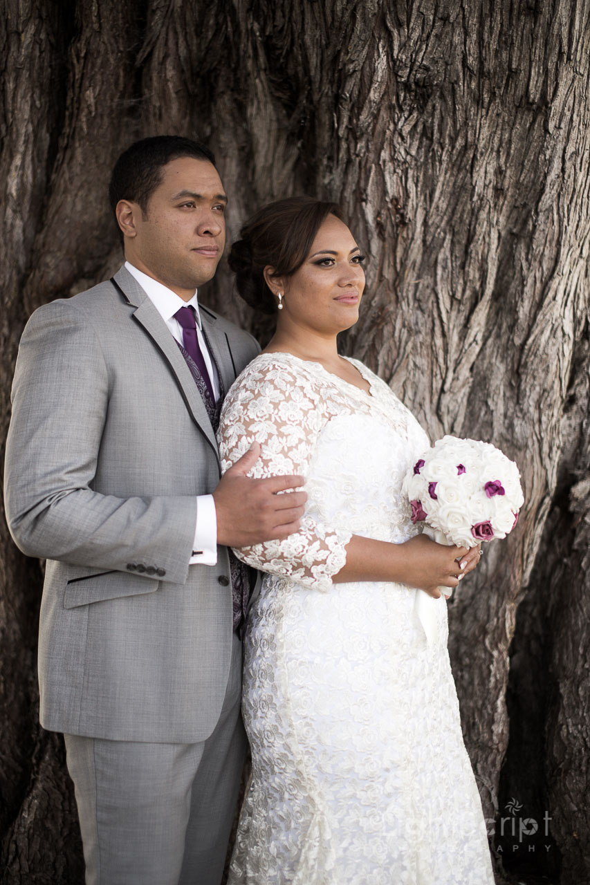 weeding couple near tree